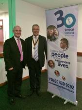 Eddie McConnell from Sense Scotland with President Robert Dickie